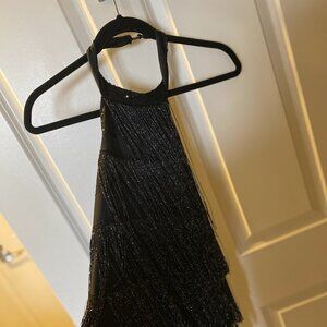 Black, backless halter dress with fringe